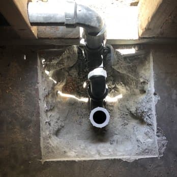 A new drain line fitted below floor level on a Fair Deal Plumbing job.